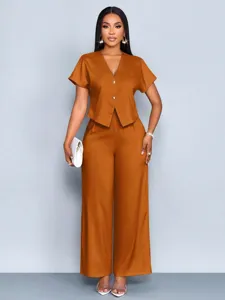 Detailed view of the stylish short-sleeve V-neck top and wide-leg trousers set.
