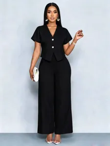 Detailed view of the elegant black short sleeve V-neck cardigan and wide leg pants set.