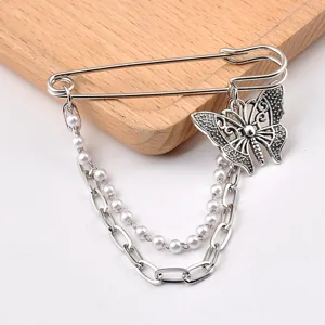 Vintage butterfly safety pin brooch with faux pearl and link chain decorations.