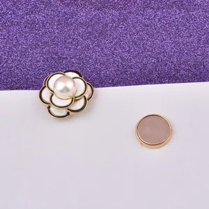 Close-up of camellia magnetic brooch with pearl and separate round backing magnet