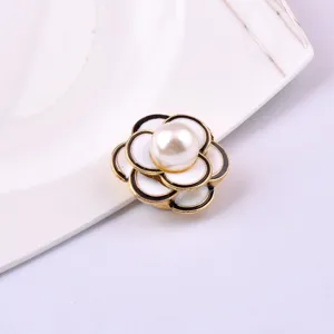 Close-up of elegant white camellia magnetic brooch with pearl center for damage-free wear