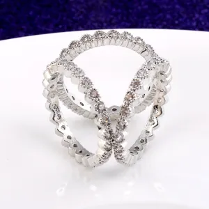 Macro detail of elegant silver triple-ring scarf buckle with sparkling zirconia stones