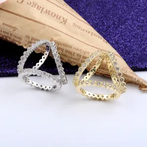 Close-up view of elegant gold and silver scarf buckles featuring shimmering crystal inlay