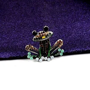 Detailed view of a vintage frog brooch with rhinestones and colorful pearl beads.
