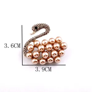 Detailed view showing dimensions of elegant champagne pearl and rhinestone swan brooch