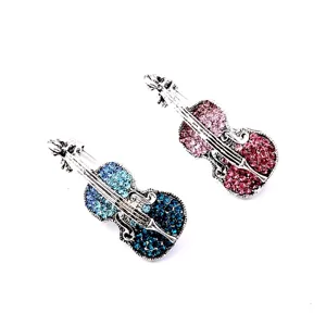 Vintage violin brooches set with sparkling blue and pink rhinestone embellishments