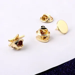 Detailed view of golden geometric mini pins including star and heart shapes with butterfly backings