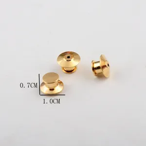 Macro view of gold-plated pin backs with 1.0cm base and 0.7cm height measurements