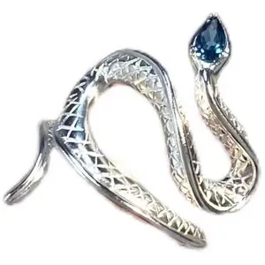 Close-up detail of silver snake ring with blue gemstone head, exquisite open jewelry design.