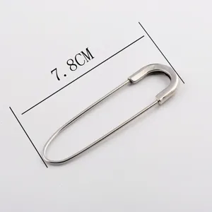 Detailed macro view of a 7.8cm large silver metal safety pin brooch for cardigans
