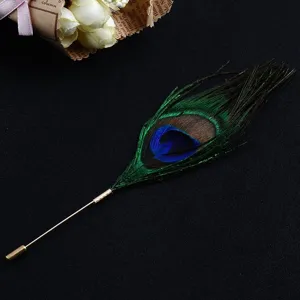 Detailed view of the natural peacock feather brooch with a golden long pin.