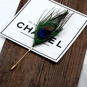 Detailed view of handmade peacock feather brooch with gold-plated long pin