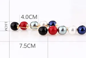 Detailansicht der Brosche mit zwei Perlen und Maßangaben von 7,5 cm und 1,6 cm Länge