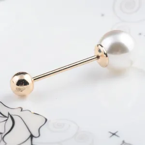 Detailed view of a double-ended pearl brooch pin with gold-tone metal and glossy pearls