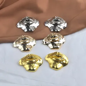 Trendy oversized 3D lip brooches in gold and silver finishes for fashion clothing accessories