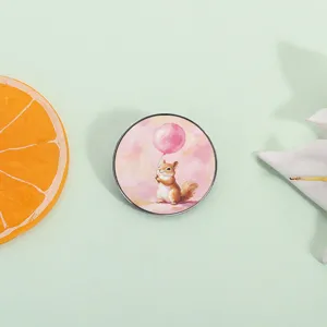 Cute cartoon squirrel badge pin holding a pink balloon, ideal summer accessory