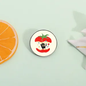 Cute cartoon black cat pin badge inside a bitten red apple on a soft green background