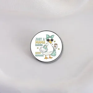 Cute mama duck brooch pin featuring 'Just a mama raising good humans' design for moms