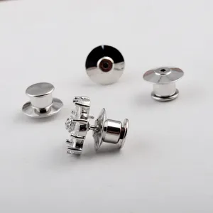 Detail shot of silver-tone electroplated brooch pin backs and crystal pin head.