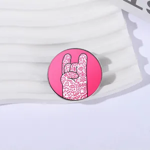 Trendy rock gesture metal pin badge with colorful hand-drawn doodle patterns on pink