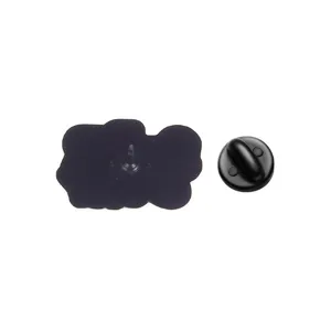 Detailed view of the back of a black enamel pin showing the secure butterfly clutch clasp.