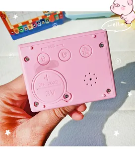 Pink electronic timer detail view, bedside countdown clock with clear buttons and battery slot.