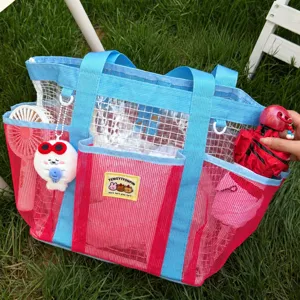Colorful mesh beach bag, large capacity travel tote handbag with multiple compartments.