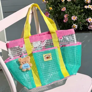Dopamine color-block mesh beach bag with dual handles, large capacity for travel use.