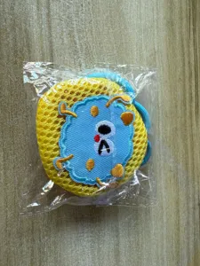 Detailed view of the cute cartoon mesh mini pouch with vibrant yellow and blue patch design.