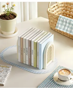 Desktop bookend organizer with rattan design and decorative book stack for office desk storage.