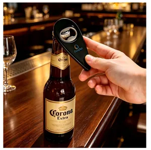 Detail view of a black magnetic bottle opener in use at a bar counter, durable and convenient tool.