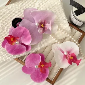 Elegant orchid flower hair clips with pearl center in purple and pink gradients