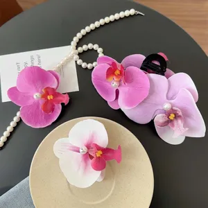 Sweet orchid flower hair clips with pearl detail for elegant spring hairstyling.