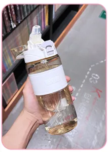 Large capacity sports water bottle with straw and silicone sleeve, portable plastic cup for students