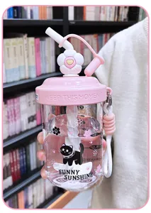 Cute pink plastic water cup with straw, daisy lid and cute black cat design for office use.