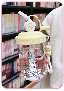 Portable plastic water bottle with straw, cute flower lid and strap for daily use.