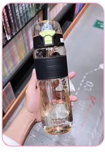 Large capacity plastic water bottle with straw and sport sleeve, portable for daily fitness.