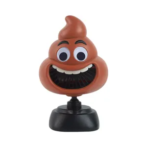 Funny cartoon poop shape USB rechargeable desktop fan with adjustable stand for office desk use.