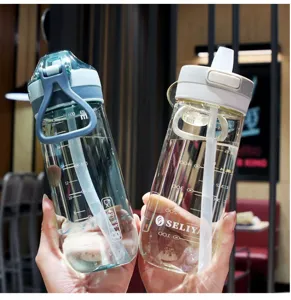 Portable large capacity plastic straw water bottle with scale marks and convenient strap for daily use.