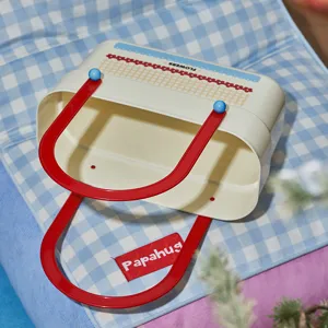 Retro plastic storage basket with cute flower pattern and red handles for daily organization.