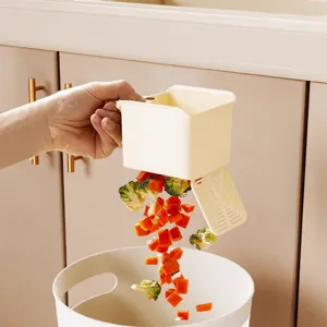 Panier égouttoir suspendu de cuisine avec couvercle à pression pour éliminer facilement les déchets.