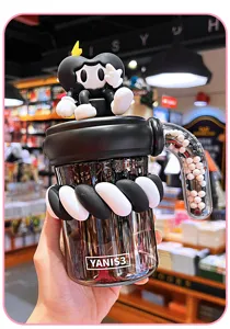 Cute black and white trendy straw cup with cartoon toy topper and twist decor for office use