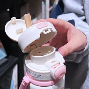 Cute dual-drink thermos cup for girls, portable straw water bottle with high capacity.