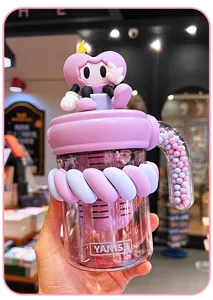 Detailed close-up of the cute cyber style water bottle with decorative character and straw design.