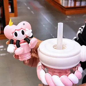 Cute Cyber YAYA flower tea cup with pink heart straw cap and portable silicone design for office.