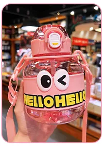 Cute pink big belly water bottle with cartoon eyes and strap, portable straw cup detail view.