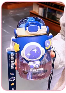 Close-up of children's astronaut water bottle with straw, cute strap and space design.