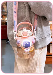 Cute pink astronaut water bottle with strap, large capacity kids straw cup for school daily use.