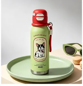 Detailed shot of cute green stainless steel thermos cup with red lid and french bulldog.