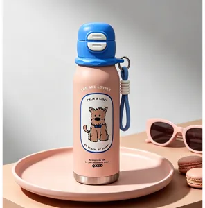 Cute stainless steel thermos cup detail featuring cartoon dog graphic and pastel pink finish.